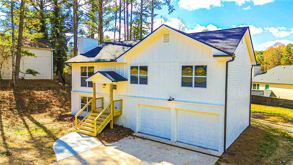 4094 Dollar Circle Suwanee, GA 30024 - Photo 4 of 56 a view of a house with wooden fence