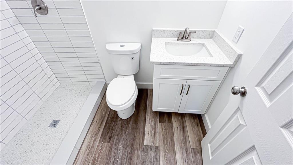 4094 Dollar Circle Suwanee, GA 30024 - Photo 48 of 56 a bathroom with a toilet and a sink