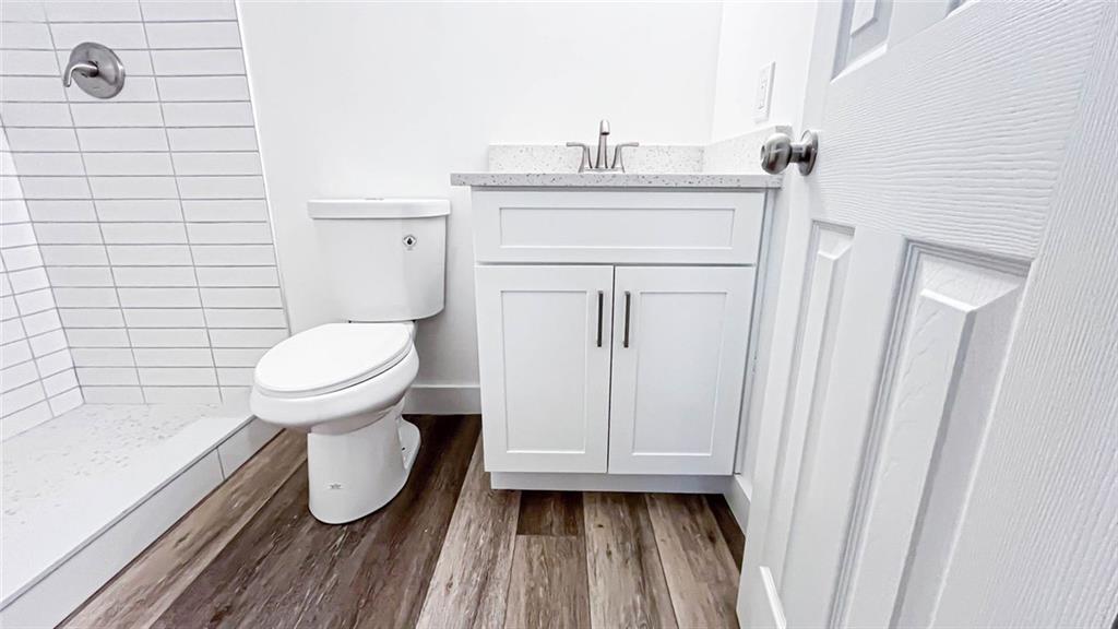 4094 Dollar Circle Suwanee, GA 30024 - Photo 49 of 56 a bathroom with a sink a toilet and shower