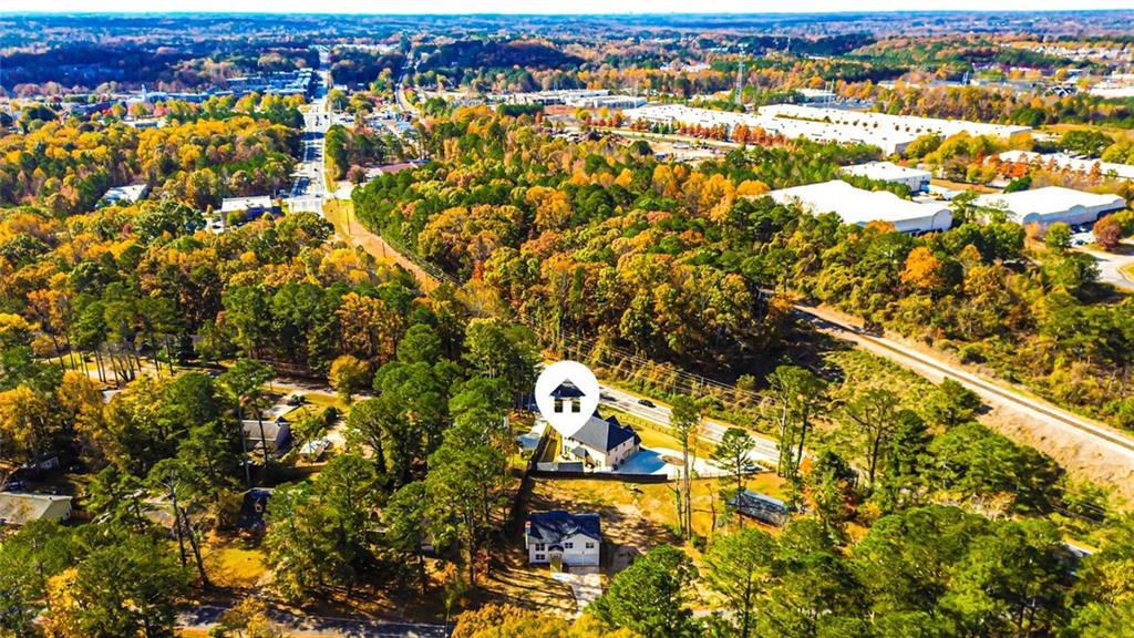 4094 Dollar Circle Suwanee, GA 30024 - Photo 52 of 56 an aerial view of residential houses with outdoor space and trees