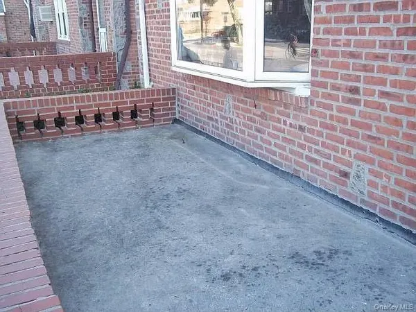 a view of a brick buildings with many windows