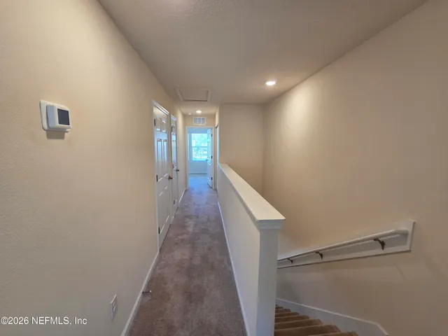a view of storage and utility room with washer and dryer