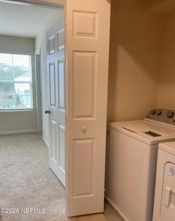 a bathroom with a double vanity sink and mirror