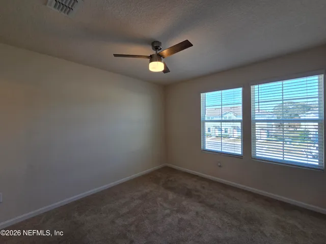 a view of a room with an empty space