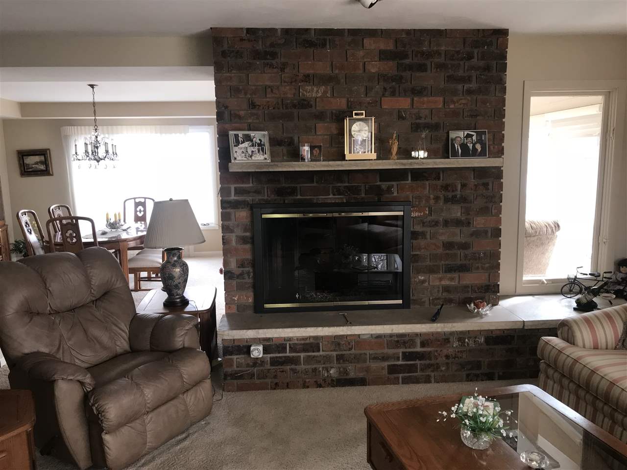 720 Roxbury Road Rockford, IL 61107 - Photo 4 of 18 a living room with furniture and a fireplace