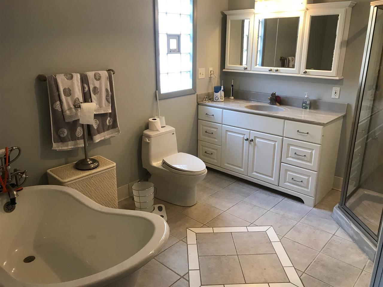 720 Roxbury Road Rockford, IL 61107 - Photo 10 of 18 a bathroom with a sink toilet and mirror