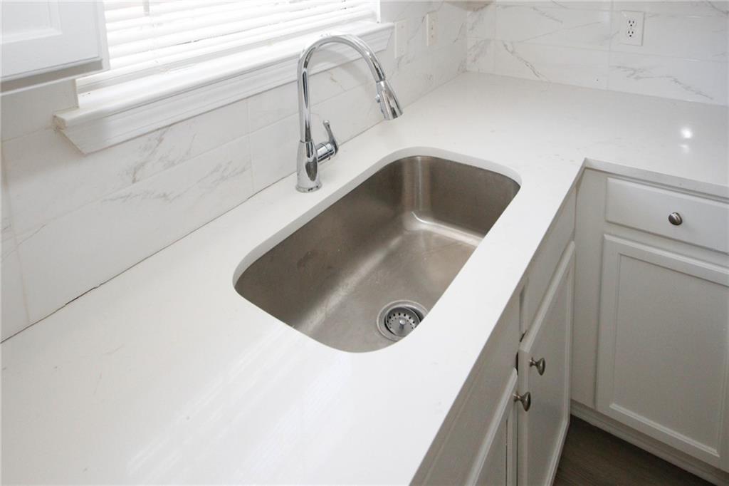 4493 Bridle Ridge Way Lithonia, GA 30038 - Photo 13 of 35 a close view of sink and tap