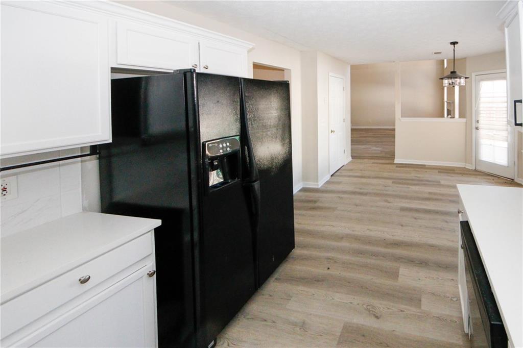 4493 Bridle Ridge Way Lithonia, GA 30038 - Photo 14 of 35 a kitchen with a refrigerator and a sink
