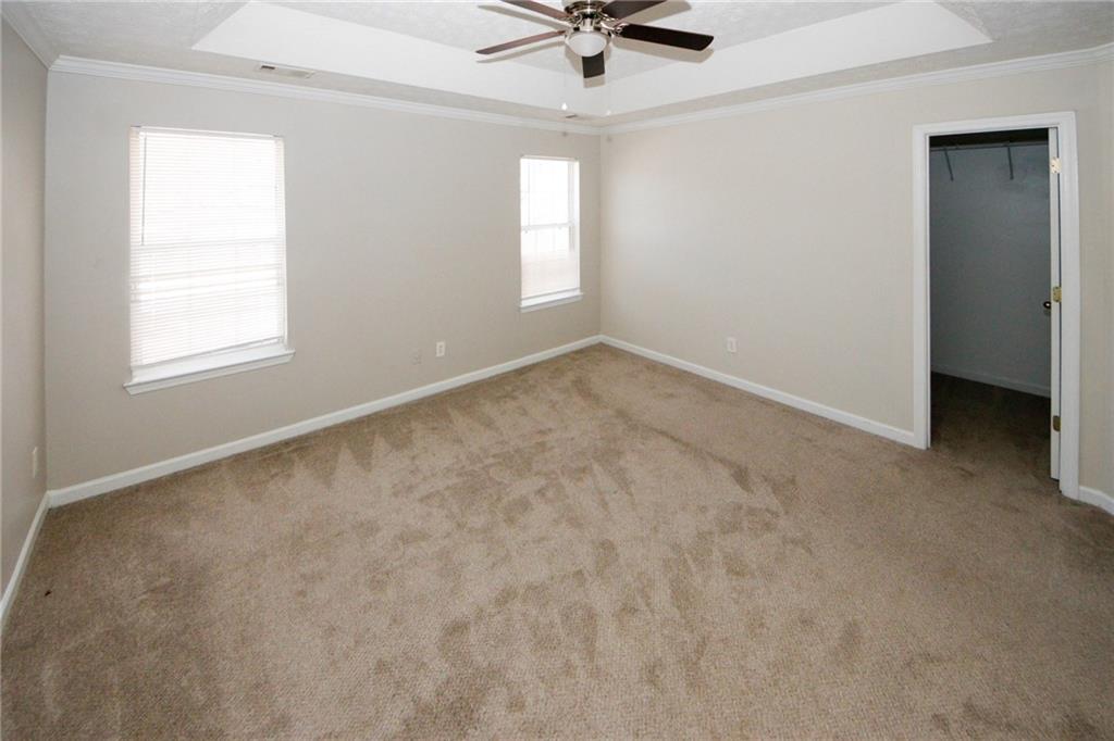 4493 Bridle Ridge Way Lithonia, GA 30038 - Photo 20 of 35 an empty room with a window and a fan