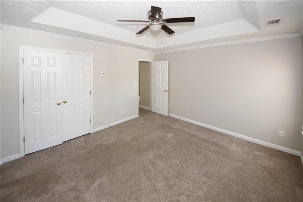 4493 Bridle Ridge Way Lithonia, GA 30038 - Photo 21 of 35 an empty room with windows and fan