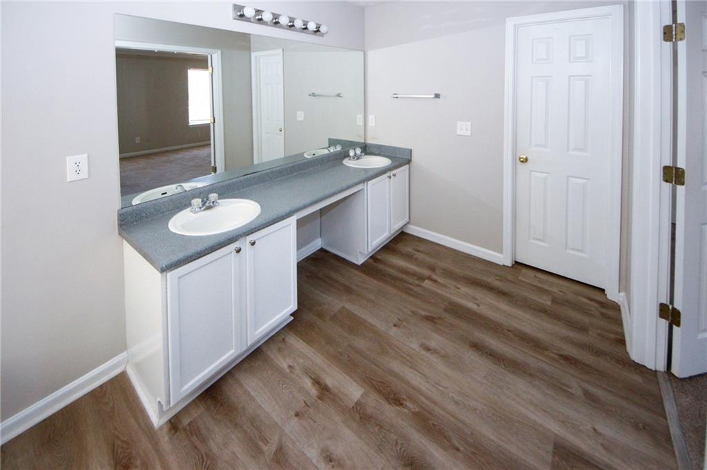 4493 Bridle Ridge Way Lithonia, GA 30038 - Photo 25 of 35 a bathroom with a sink and mirror