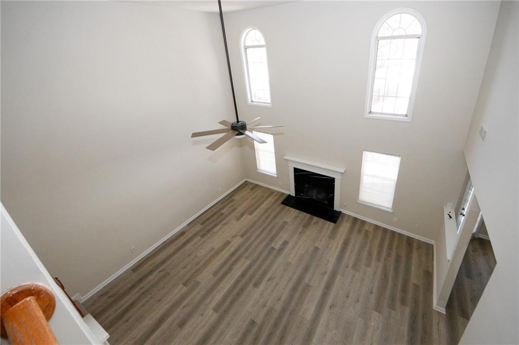 4493 Bridle Ridge Way Lithonia, GA 30038 - Photo 5 of 35 a view of a room with wooden floor and a fireplace