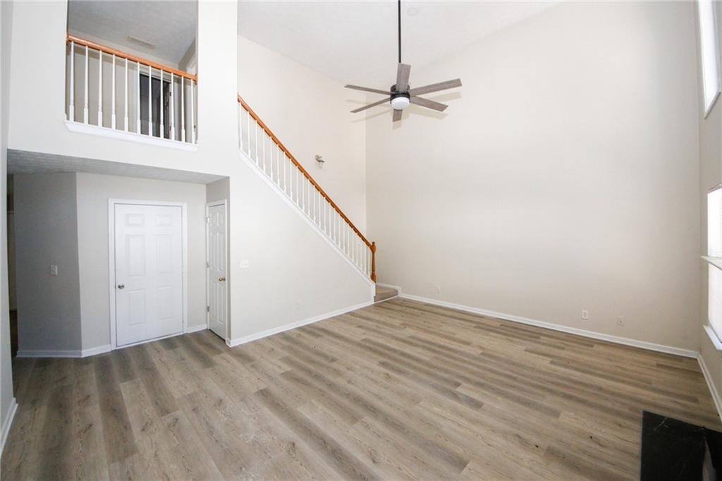 4493 Bridle Ridge Way Lithonia, GA 30038 - Photo 8 of 35 a view of an empty room with stairs