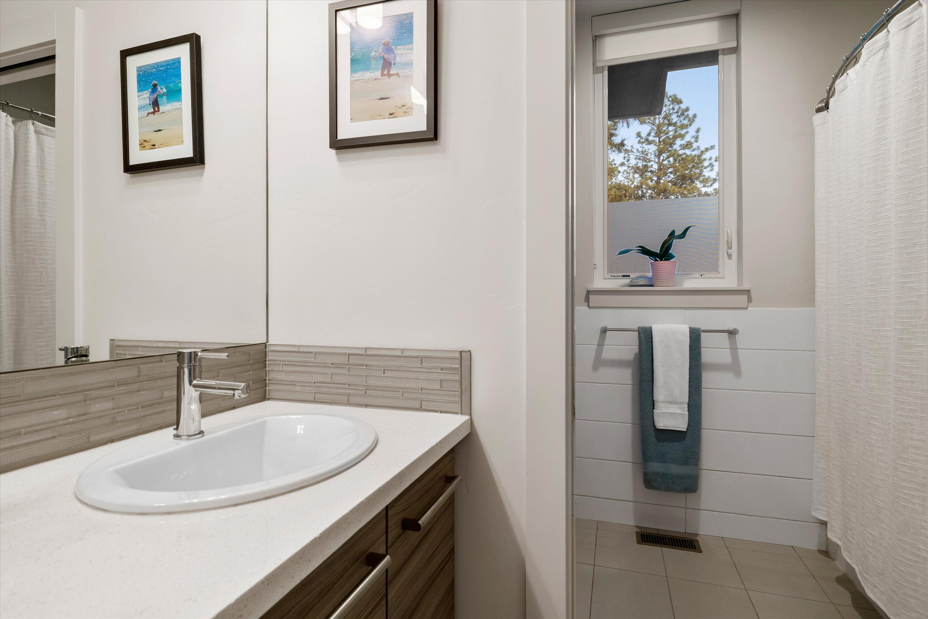 19504 Southwest Century Drive Bend, OR 97702 - Photo 36 of 58 a bathroom with a sink and a mirror