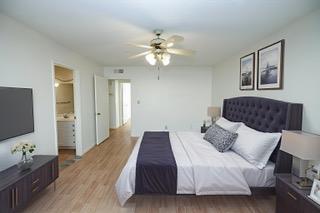 617 West Granger Avenue, Unit 17 Modesto, CA 95350 - Photo 12 of 24 a bedroom with a bed and a flat screen tv