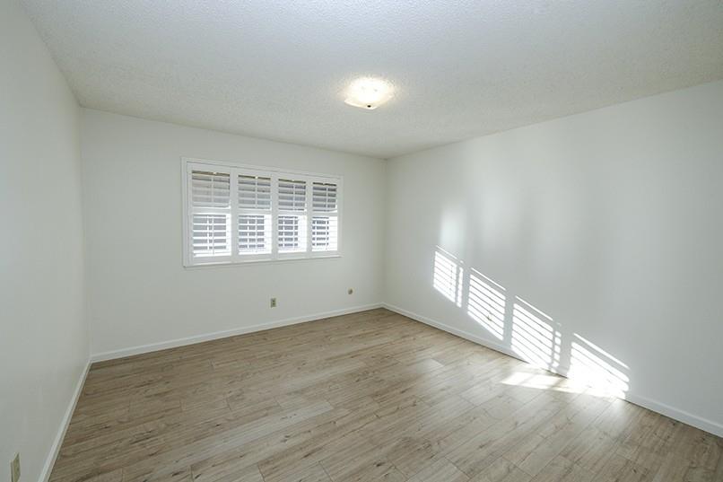 617 West Granger Avenue, Unit 17 Modesto, CA 95350 - Photo 17 of 24 wooden floor in an empty room with a window