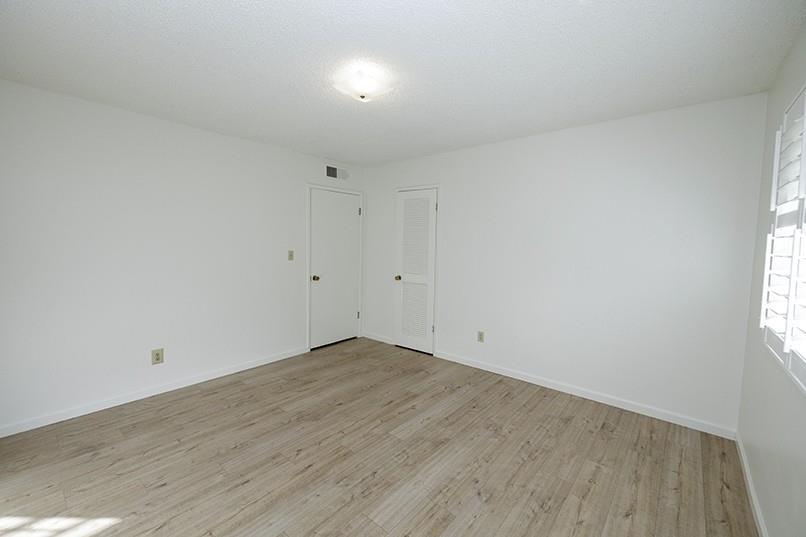 617 West Granger Avenue, Unit 17 Modesto, CA 95350 - Photo 18 of 24 an empty room with wooden floor