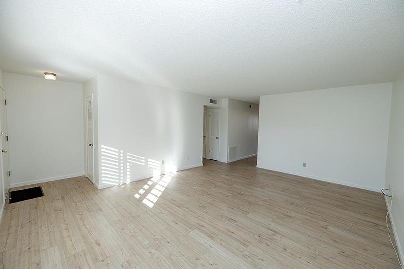 617 West Granger Avenue, Unit 17 Modesto, CA 95350 - Photo 3 of 24 a view of empty room with wooden floor