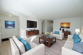 617 West Granger Avenue, Unit 17 Modesto, CA 95350 - Photo 4 of 24 a living room with furniture and a flat screen tv