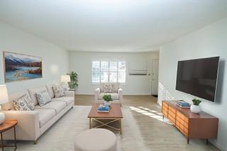 617 West Granger Avenue, Unit 17 Modesto, CA 95350 - Photo 6 of 24 a living room with furniture and a flat screen tv