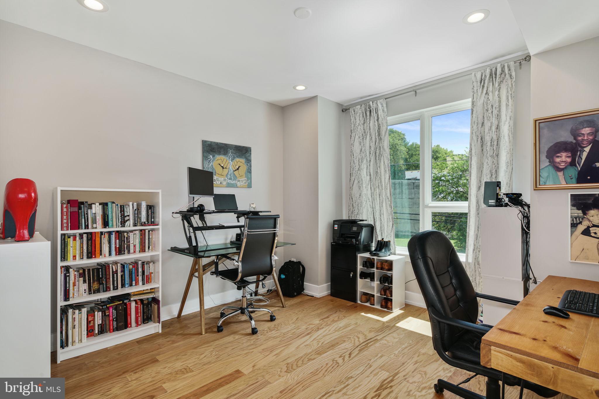 2711 West Jefferson Street, Unit 2 Philadelphia, PA 19121 - Photo 15 of 27 a view of a workspace with furniture and a bookshelf
