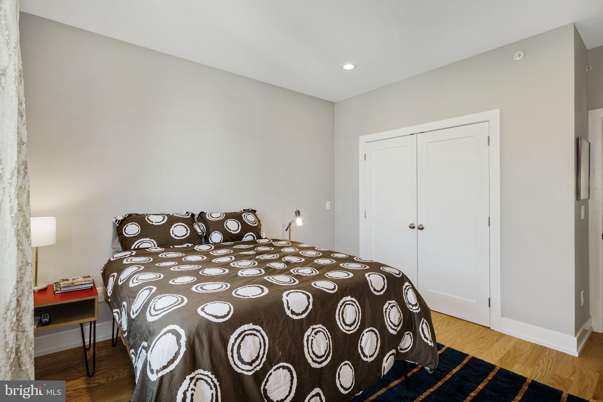 2711 West Jefferson Street, Unit 2 Philadelphia, PA 19121 - Photo 19 of 27 a bedroom with a bed and a painting on the wall