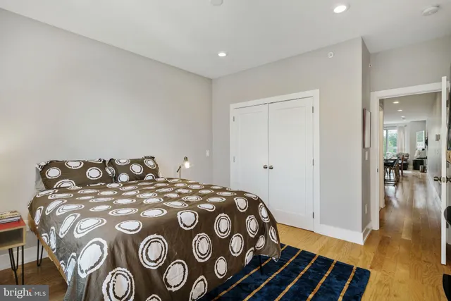 a bedroom with a bed and a view of bathroom
