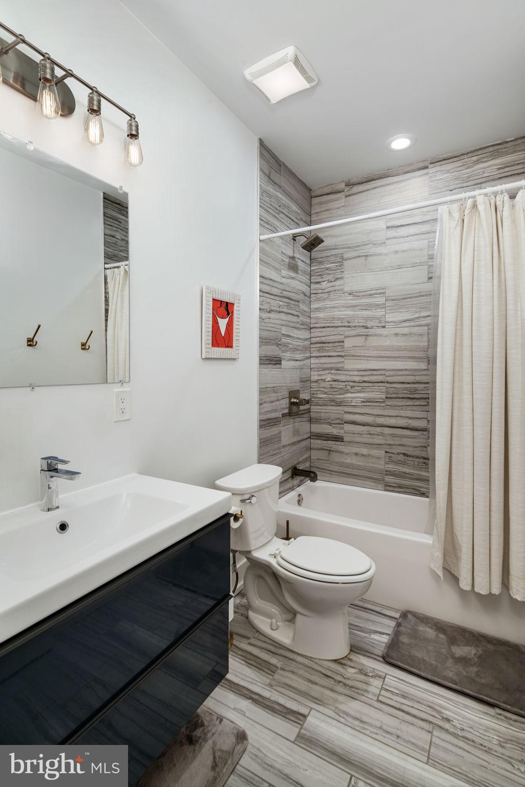 2711 West Jefferson Street, Unit 2 Philadelphia, PA 19121 - Photo 22 of 27 a bathroom with a sink toilet and shower