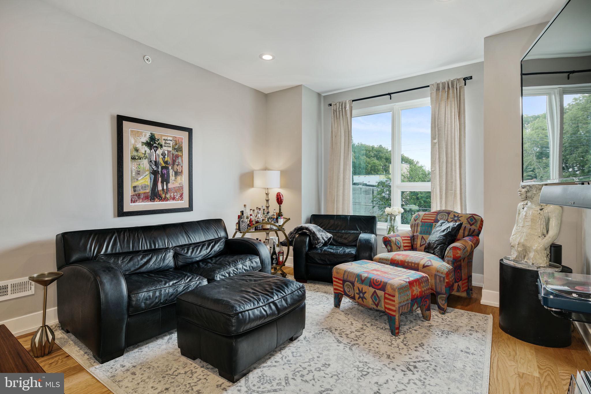 2711 West Jefferson Street, Unit 2 Philadelphia, PA 19121 - Photo 4 of 27 a living room with furniture and a large window
