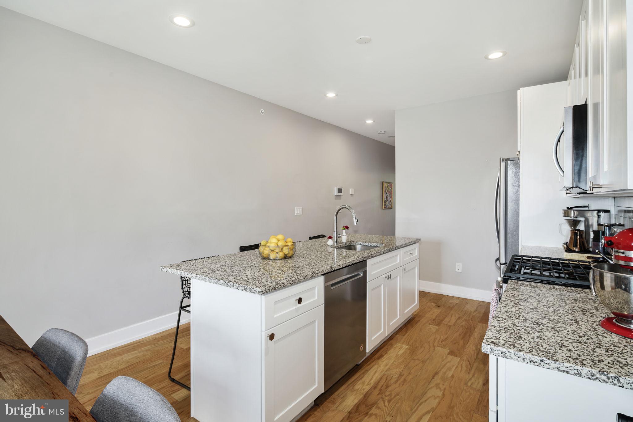 2711 West Jefferson Street, Unit 2 Philadelphia, PA 19121 - Photo 7 of 27 a kitchen with a sink stove and refrigerator
