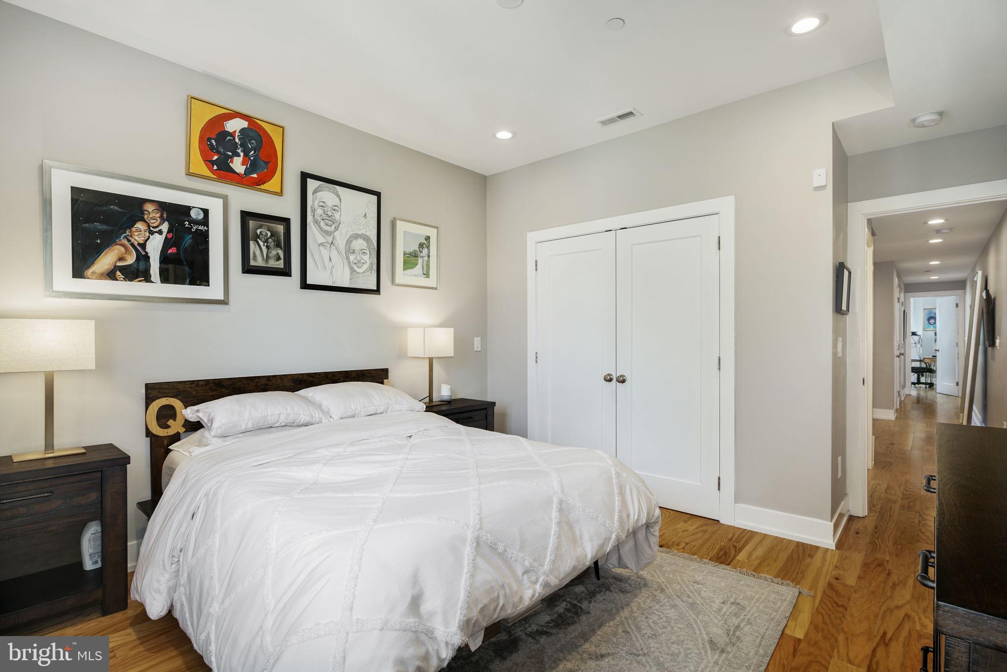 2711 West Jefferson Street, Unit 2 Philadelphia, PA 19121 - Photo 9 of 27 a spacious bedroom with a bed and a flat screen tv