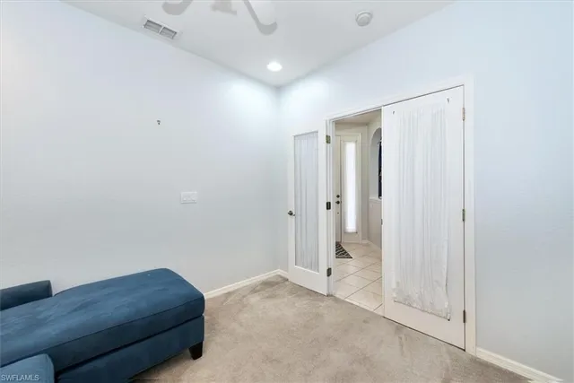 a bathroom with a tub double vanity sink and a mirror