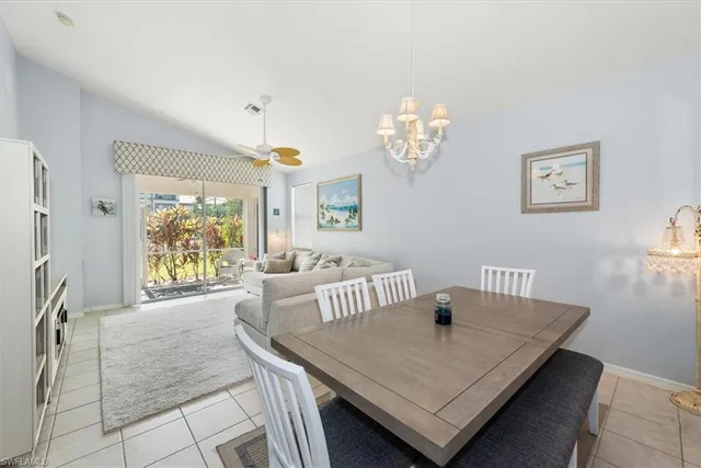 a very nice looking room with a large window and couch