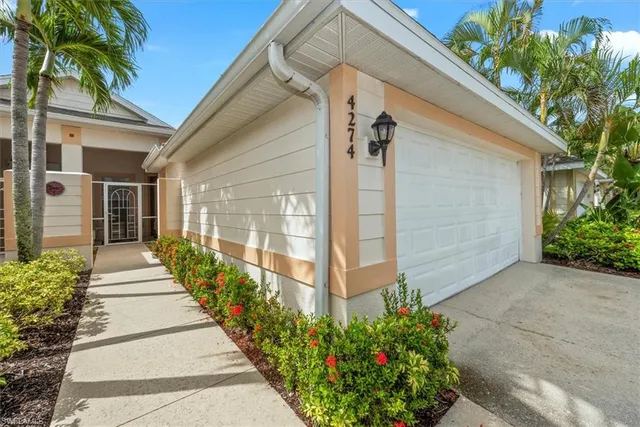 a view of garage and yard