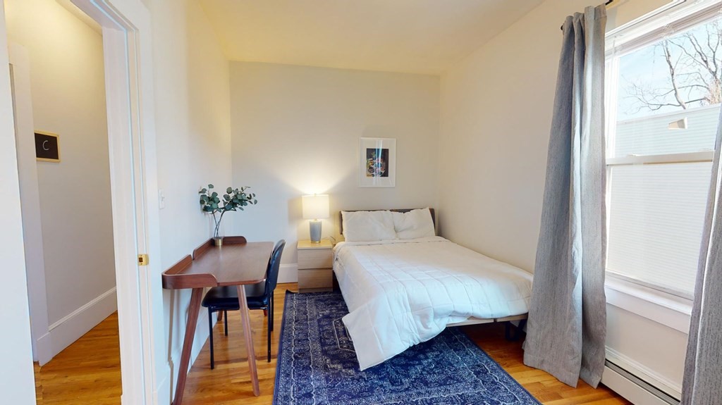 11 Elder Street, Unit 3 Boston, MA 02125 - Photo 12 of 26 a bedroom with furniture and a window