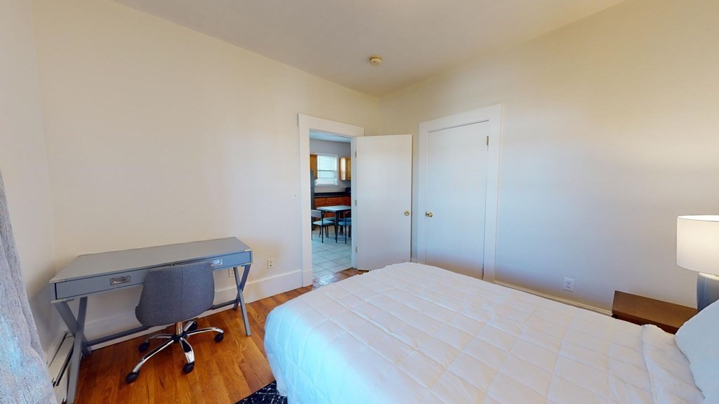 11 Elder Street, Unit 3 Boston, MA 02125 - Photo 13 of 26 a bedroom with a bed and a closet