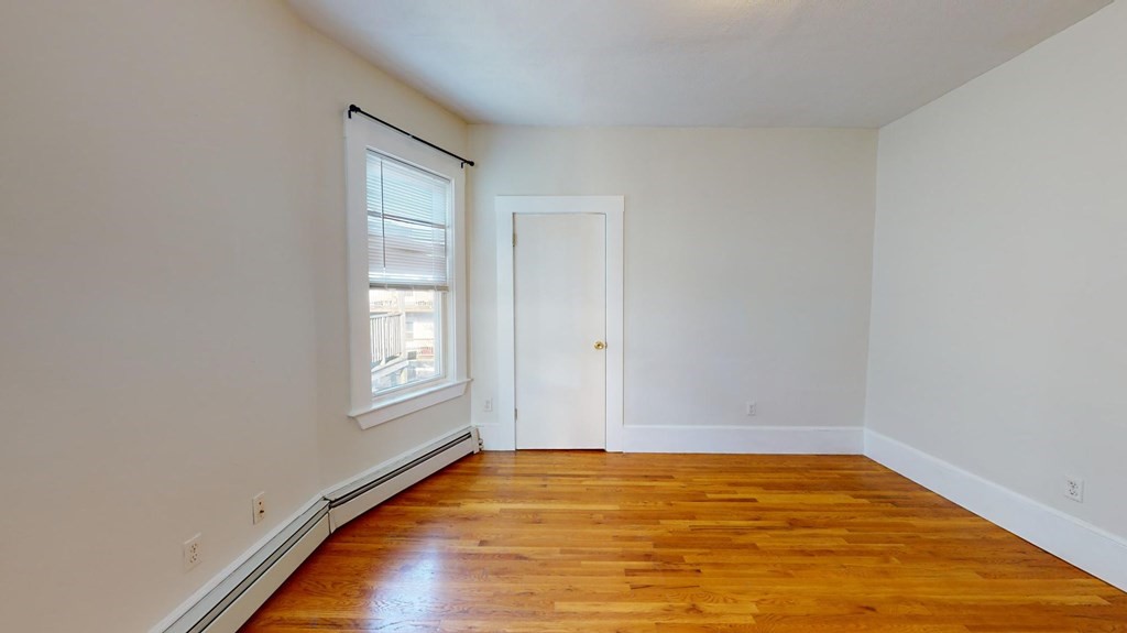 11 Elder Street, Unit 3 Boston, MA 02125 - Photo 18 of 26 an empty room with window