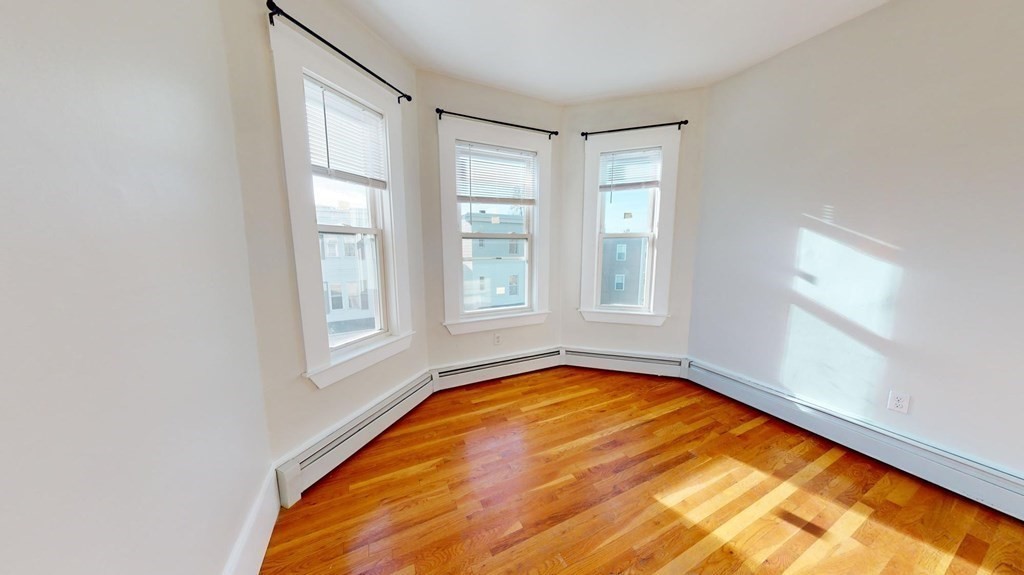 11 Elder Street, Unit 3 Boston, MA 02125 - Photo 4 of 26 a view of a bedroom with windows