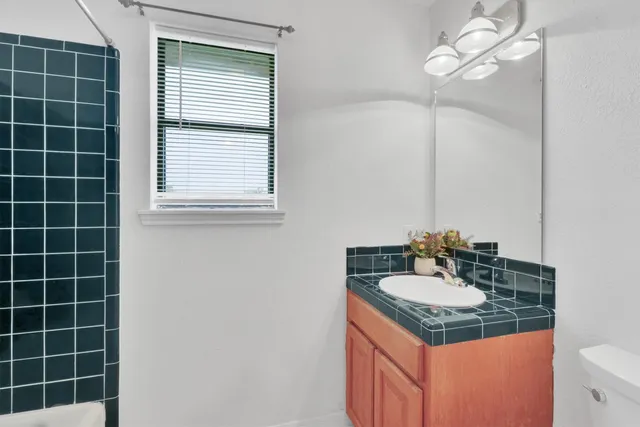 a view of hallway with wooden floor