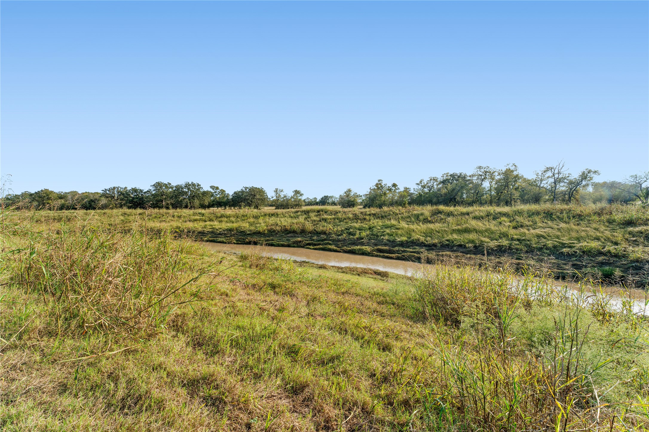 5619 Boothline Road Richmond, TX 77469 - Photo 18 of 30 a view of a lake with houses in the back