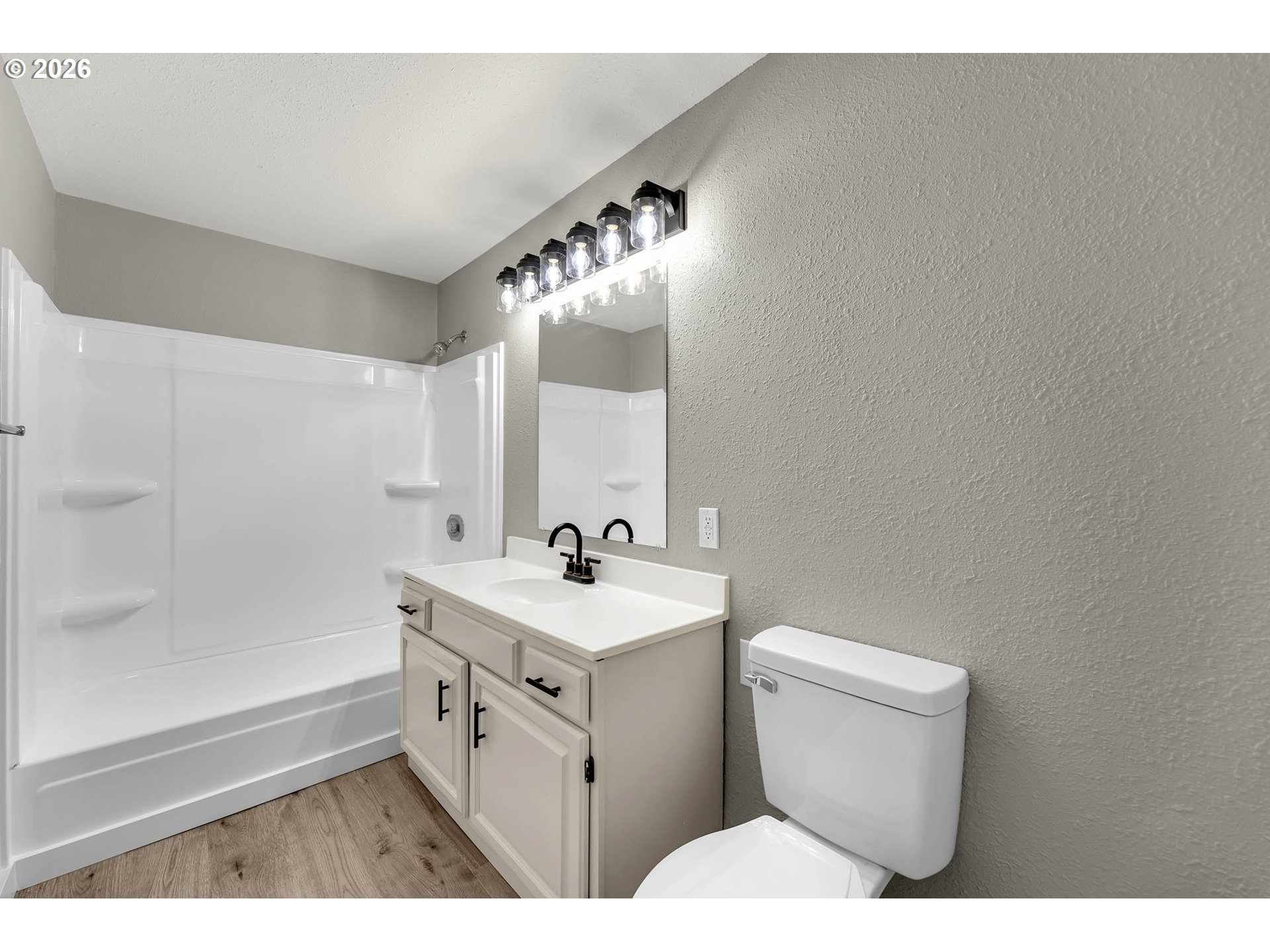 30921 Northwest Spencer Road La Center, WA 98642 - Photo 18 of 39 a bathroom with a sink a toilet and mirror