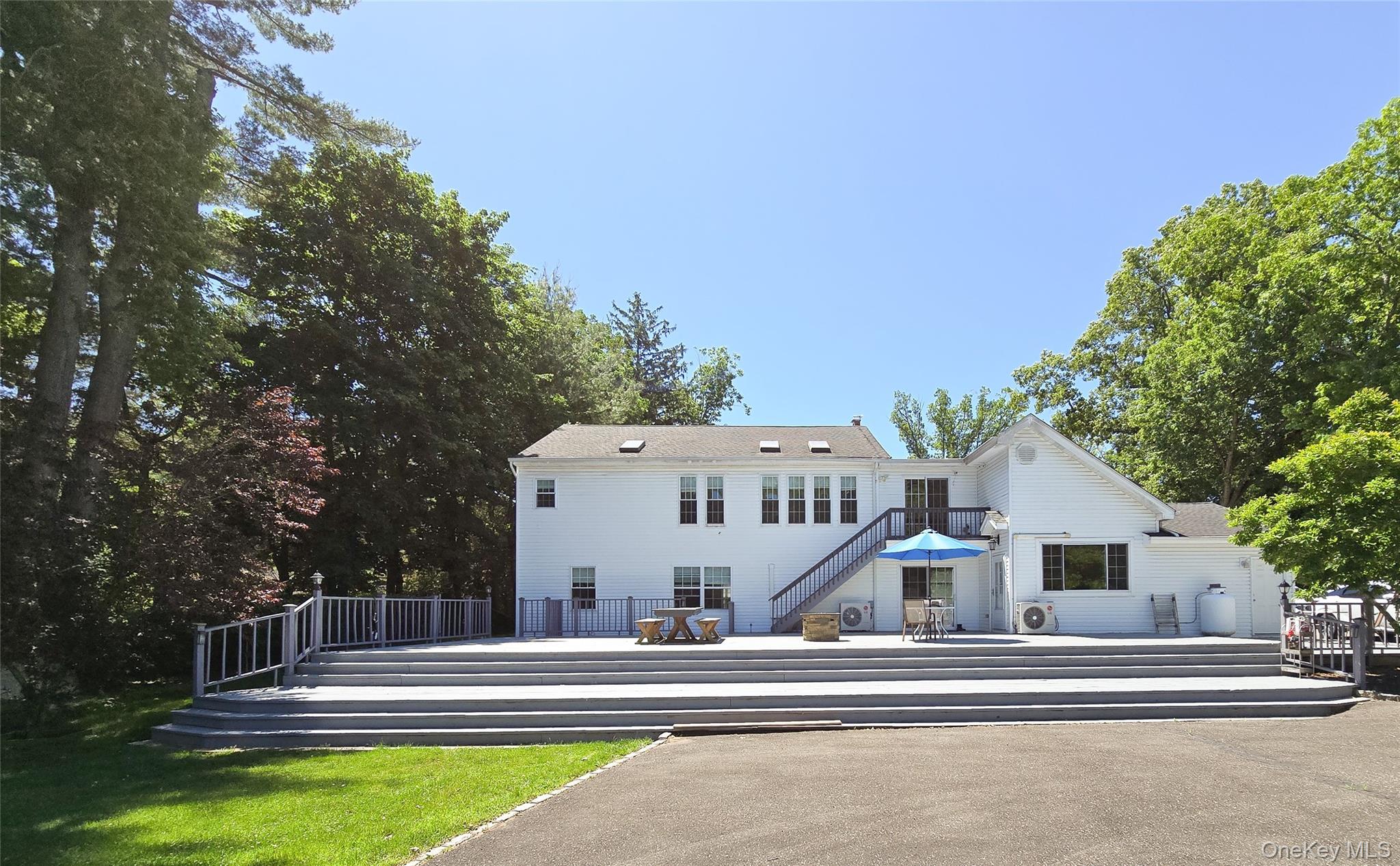 249 Cold Spring Road Syosset, NY 11791 - Photo 21 of 28 a view of house with a swimming pool