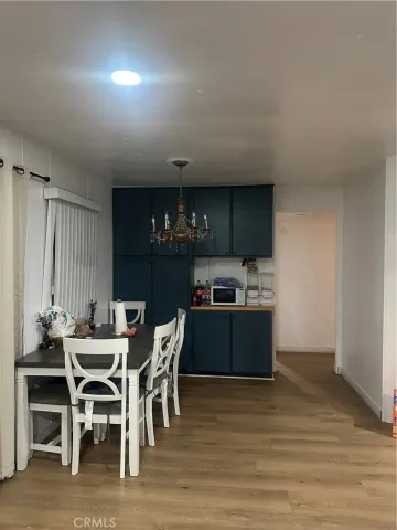 a kitchen with a table and chairs in it
