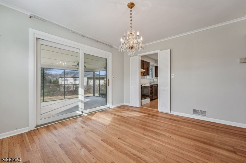 35 South Derby Road Springfield, NJ 07081 - Photo 12 of 30 a view of an empty room with wooden floor and a window