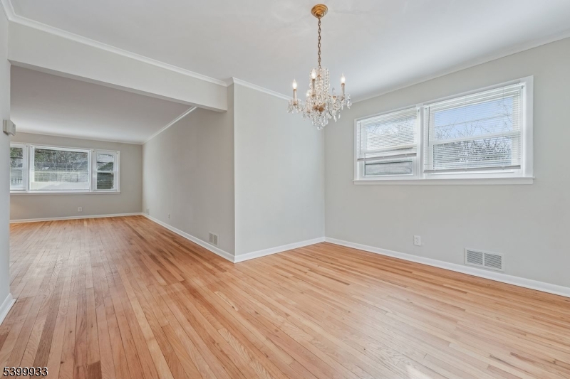 35 South Derby Road Springfield, NJ 07081 - Photo 14 of 30 a view of an empty room with wooden floor and a window