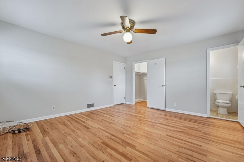 35 South Derby Road Springfield, NJ 07081 - Photo 22 of 30 a view of empty room with wooden floor and ceiling fan