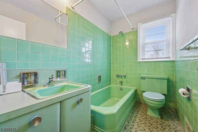 35 South Derby Road Springfield, NJ 07081 - Photo 24 of 30 a bathroom with a sink a toilet and bathtub