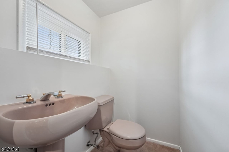 35 South Derby Road Springfield, NJ 07081 - Photo 28 of 30 a white toilet sitting next to a white sink