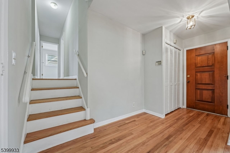 35 South Derby Road Springfield, NJ 07081 - Photo 4 of 30 a view of a hallway with wooden floor and entryway