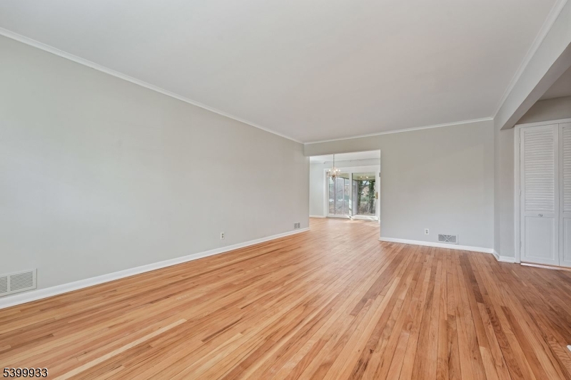35 South Derby Road Springfield, NJ 07081 - Photo 10 of 30 an empty room with wooden floor and windows